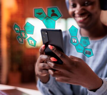 Main photo woman navigating on phone with artificial intelligence pictograms original 2323823 1 360x320