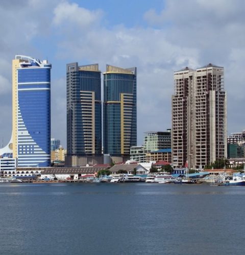 Left to right, the Tanzania Ports Authority Tower, Public Service Pension Fund Commercial Twin Towers, and Mwalimu Nyerere Foundation Square rise above Dar es Salaam's waterfront.